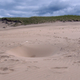 Illustration for article titled No One Knows Why Deep, Dangerous Holes Are Appearing In This Sand Dune